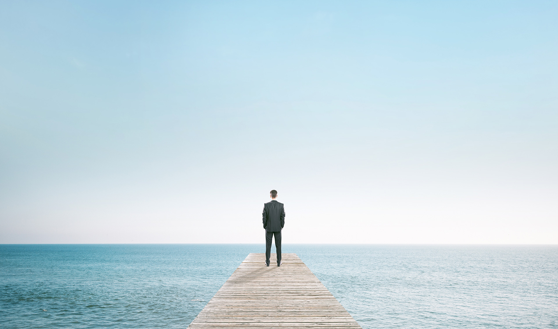 Man standing on pier